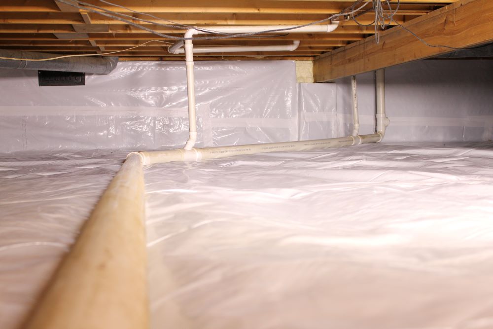 Encapsulated Crawl Space with PVC pipe running through it - Atlantic Foundation