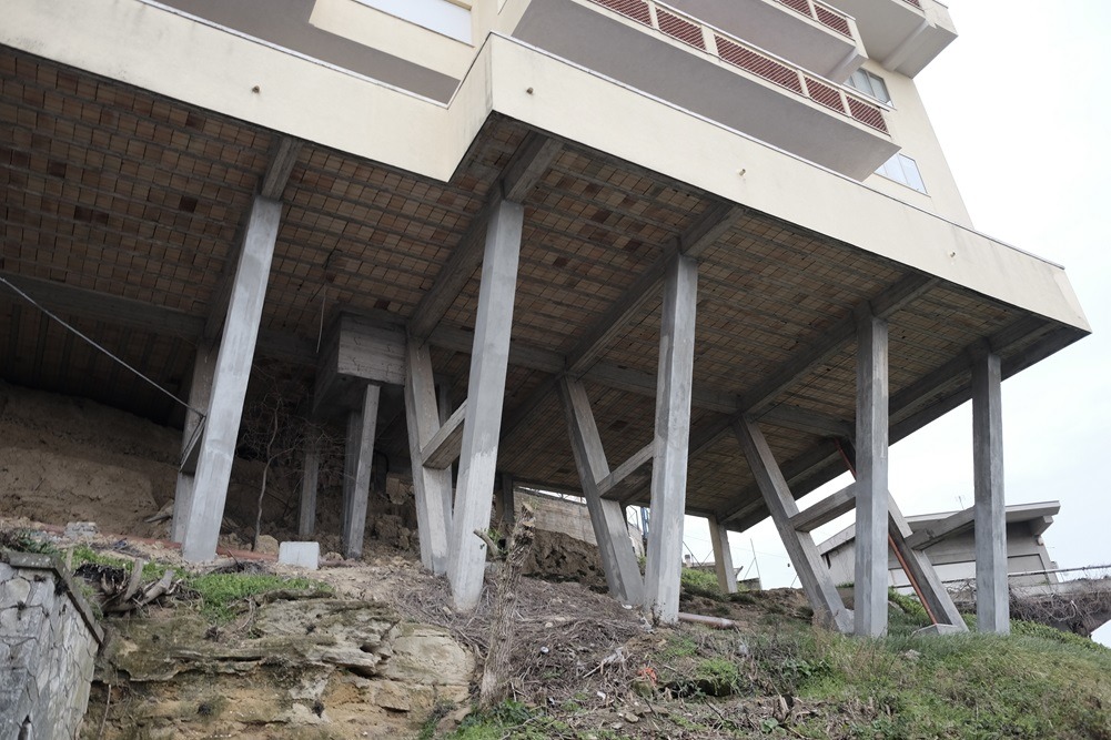 house is situated on an eroding cliff